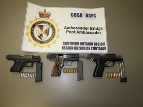 Undeclared handguns and prohibited magazines seized at the Ambassador Bridge are pictured in this handout photo.