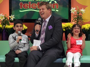 Joshua Zeiter (left), Dave Hunter (centre) and Angelina Boschin talk on air at the 30th Annual Easter Seals Windsor-Essex Telethon Saturday, April 6, 2013 at TVCogeco. (THE WINDSOR STAR/ Kristie Pearce)