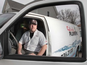 John Bondy of CJ Bondy Plumbing is shown Tuesday, April 9, 2013, at the Amherstburg, Ont. business he operates with his father Chuck Bondy. They are among the 150,000 tradespeople in the province who now have to start paying membership fees to the Ontario College of Trades. (DAN JANISSE/The Windsor Star)