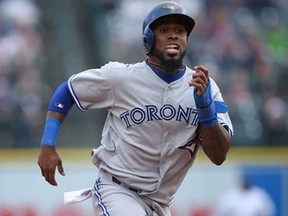 Jose Reyes of the Toronto Blue Jays scores from second base against the Detroit Tigers at Comerica Park on April 9, 2013 in Detroit, Michigan. The Tigers defeated the BlueJays 7-3. (Leon Halip/Getty Images)