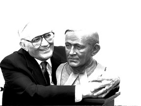 June 4, 1990. Judge Paul Staniszewski hugs a bronze image of himself, made by sculptor Christoper Rees. (Windsor Star files)