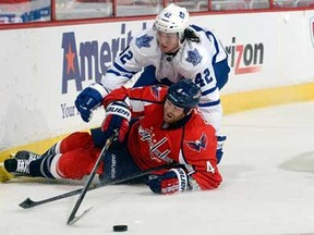 Washington's John Erskine, bottom, is pulled down by Toronto's Tyler Bozak at the Verizon Center on April 16, 2013 in Washington, DC.  (Photo by Greg Fiume/Getty Images)