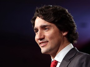 Justin Trudeau takes the stage as leader of the Liberal Party in Ottawa, Sunday April 14, 2013. THE CANADIAN PRESS/Fred Chartrand