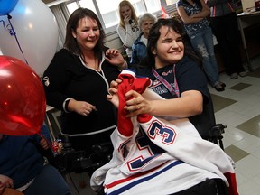Madison Brennan is joined by her mother Carol Brennan (left) as she is presented with a trip to Montreal from the Sunshine Foundation at Kingsville District High School on Friday , February 18, 2011. Brennan, who suffers from Cerebral Palsy, will get to see the Montreal Canadians take on the Toronto Maple Leafs.     (TYLER BROWNBRIDGE / The Windsor Star)