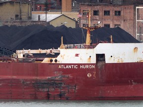 Petroleum coke is loaded onto a Canada Steamship Lines freighter Thursday, March 28, 2013, along the banks of the Detroit river in Detroit, MI. (DAN JANISSE/The Windsor Star)