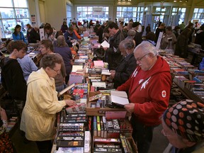 Book lovers browse through boxes of donated books at the Raise a Reader Book Sale last year on April 14, 2012.  (Windsor Star files)