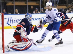 Rangers goalie Henrik Lundqvist, left, makes a save as Toronto's Nazem Kadri watches for a rebound at Madison Square Garden April 10, 2013 in New York City.  (Al Bello/Getty Images)