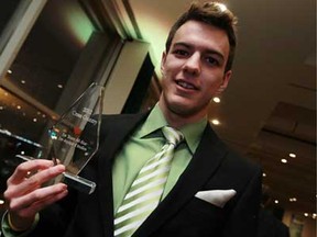 Cross country runner Andrew deGroot accepts his awards at the St. Clair College athletic awards banquet at the St. Clair Centre for the Arts in Windsor on Thursday, April 11, 2013.                             (TYLER BROWNBRIDGE/The Windsor Star)
