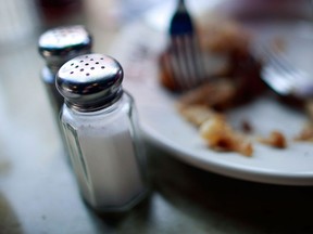 An important step to control high blood pressure is limiting salt in diets. On average, Canadians consume more than 3,400 mg of sodium a day, far more than the  recommended level of 2,300 mg. (MARIO TAMA / Getty Images)