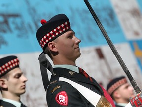 A member of the Essex and Kent Scottish Regiment prepares to march down Sandwich Street. (DAX MELMER/The Windsor Star)