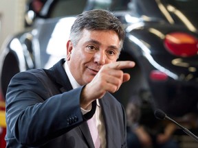 In this file photo, Ontario Finance Minister Charles Sousa answers questions from the media at a press conference in a Canadian Tire store in Toronto, Ont. on April 30, 2013. (Chris Young / Canadian Press)