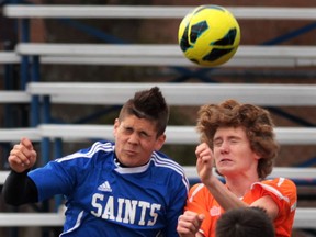 St. Anne's Michael Brait (L) and Sandwich's Elias Wilson battle for the ball during their game Tuesday, April 9, 2013, in Lasalle, Ont. (DAN JANISSE/The Windsor Star)