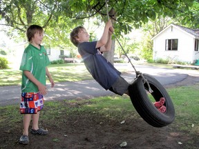 The tire swing.....ahh, those were the days when kids were outside playing and not inside wasting away brain cells. (REB STEVENSON / Postmedia News files)