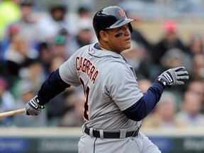 Detroit's Miguel Cabrera hits an RBI single against the Minnesota Twins April 3, 2013 at Target Field in Minneapolis. (Hannah Foslien/Getty Images)