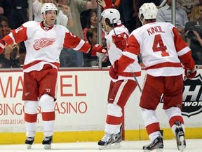 Detroit's Daniel Cleary, left, celebrates his goal with Gustav Nyquist, centre, and Jakub Kindl against the Ducks in Game 1 of the Western Conference Quarterfinals at Honda Center on April 30, 2013 in Anaheim, California.  (Photo by Harry How/Getty Images