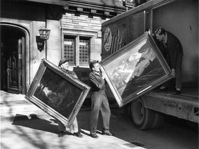 The Windsor Art Association has moved out of Willistead Library after a year -long fight with the Windsor Library Board. Moving some of the $30,000 worth of paintings for the gallery to storage on April 7, 1959 are, from left: Delmer Willick, Adrian Verhulst and Leonard Warner, employees of Windsor Moving and Storage Ltd. (FILES/The Windsor Star)