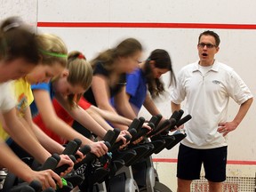 David Guthrie, Active Schools Co-ordinator with Windsor Squash and Fitness Club with group of students from Hugh Beaton Public School in the 'spinning station' of their workout. (NICK BRANCACCIO/The Windsor Star)