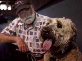 Ken Killen sits with his newly adopted 5-year-old Wheaten Terrier, Quincy, at the second annual Petpalooza at Roseland Golf and Curling Club,Saturday, May 4, 2013.  (DAX MELMER/The Windsor Star)