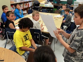 Keegan Renaud explains how he got and answer during a Grade 3 math class at St. Angela Catholic Elementary School in Windsor on Thursday, May 16, 2013.                        (TYLER BROWNBRIDGE/The Windsor Star)