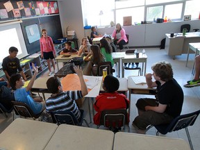 Students present their work on an assignment during a Grade 6 math class at St. Angela Catholic Elementary School in Windsor in this May 16, 2013 file photo. (TYLER BROWNBRIDGE/The Windsor Star)