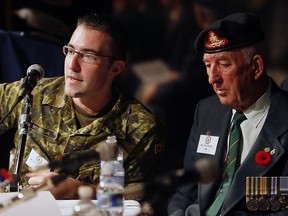 Canadian military veterans Bruce Moncur, left, and Glen Dibbley, share their stories of service with Grade 10 students at St. Joseph's High School during the 'Veterans Speak to Students Project' in 2009. Moncur, who was critically injured by friendly fire in Afghanistan in 2006, was selected along with 11 other Canadians for the three-week Canadian Battlefields Foundation 2013 study tour and will head to France on Friday.(Windsor Star files)