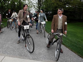 Stephen Hargreaves, centre, and Chris Holt, right, lead the group while leaving the Hiram Walker garden during the Spring 2013 Windsor Tweed Ride, Saturday, May 11, 2013.  (DAX MELMER/The Windsor Star)