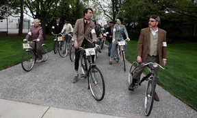 Stephen Hargreaves, centre, and Chris Holt, right, lead the group while leaving the Hiram Walker garden during the Spring 2013 Windsor Tweed Ride, Saturday, May 11, 2013.  (DAX MELMER/The Windsor Star)