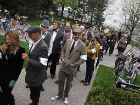 People wait in line for a drink at the Hiram Walker's garden during the first stop of the Spring 2013 Windsor Tweed Ride, Saturday, May 11, 2013.  (DAX MELMER/The Windsor Star)