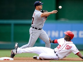 Washington's Roger Bernadina, right, is forced out at second base in the first inning by Detroit's Jhonny Peralta Thursday at Nationals Park in Washington. (Photo by Greg Fiume/Getty Images)