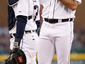 Detroit's Justin Verlander, right, talks with catcher Alex Avila after walking Jason Giambi of the Cleveland Indians with the bases loaded in the first inning at Comerica Park. (Photo by Duane Burleson/Getty Images)