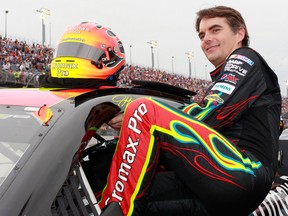 Jeff Gordon, driver of the No. 24 Cromax Pro Chevrolet, climbs into his car during the NASCAR Sprint Cup Series Bojangles' Southern 500 at Darlington Raceway in Darlington, South Carolina.  (Photo by Geoff Burke/Getty Images)