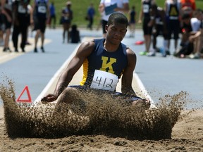 Dominic Domas competes in the long jump during the WECSSAA track and field championships at Alumni Field in Windsor Thursday. (TYLER BROWNBRIDGE/The Windsor Star)