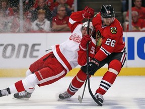 Detroit's Valtteri Filppula, left, collides with Chicago's Michal Handzus in Game 2 of the Western Conference semifinal. (Photo by Jonathan Daniel/Getty Images)