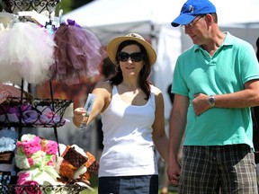 Debra Ruys, left, and her husband Michael browse through Art in the Park at Willistead park, Sunday, June 5, 2011. (DAX MELMER / The Windsor Star)