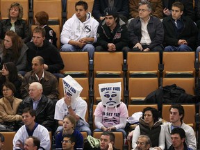 File photo of upset Toronto Maple Leafs fans, middle, wearing a bag on their heads. (Windsor Star files)