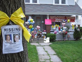 A collection of celebratory balloons and stuffed animals crowds the entrance to the home of the sister of Amanda Berry on Tuesday, May 7, 2013, one of three women found alive in a house a few miles away after disappearing years earlier, in a west side Cleveland, Ohio neighborhood. Many people who dropped off balloons said they didn't know Berry personally but wanted to celebrate her safe return. (AP Photo/Andrew Welsh-Huggins)