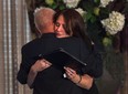 Widow Sharlene Bosma receives a hug from Tim Bosma's father at a memorial in Hamilton, Ont., Wednesday, May 22, 2013, for her husband Tim Bosma, the Hamilton, Ont., man found dead after he took two men on a test drive.THE CANADIAN PRESS. THE CANADIAN PRESS/Nathan Denette