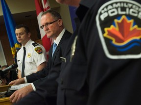 Det.Sgt Matt Matt Kavanagh, centre, discusses the Timothy Bosma missing man case at a news conference in Hamilton, Ont., Tuesday, May 14, 2013. A massive search for Bosma, a southern Ontario man who vanished more than a week ago, came to a grim conclusion Tuesday when police announced his body had been found.THE CANADIAN PRESS/Nathan Denette