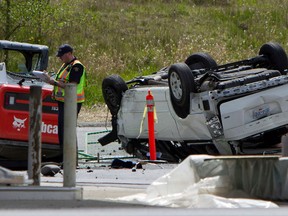 Police investigate the aftermath of a fatal car crash at the intersection of 176th Street and 32nd Avenue in Surrey, B.C. on Sunday, April 28, 2013. RCMP in British Columbia say five people are dead after a serious crash near the U.S border.THE CANADIAN PRESS/Eric Dreger