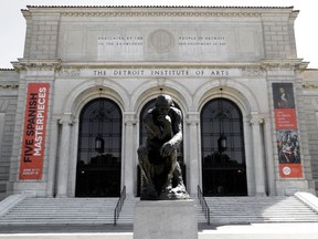Auguste Rodin's sculpture "The Thinker" is shown outside The Detroit Institute of Arts in Detroit, Tuesday, July 10, 2012. (AP Photo/Paul Sancya)