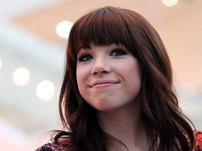 Canadian singer Carly Rae Jepsen smiles at members of the media during a press conference on Wednesday, May 22, 2013, in Singapore ahead of the inaugural Social Star Awards. (AP Photo/Wong Maye-E)