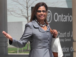 Kay Curtis was found not guilty Thursday, May 2, 2013, of criminal harassment of her husband, children's author Christopher Curtis. Here she exits the Ontario Court in Windsor, Ont. (DAN JANISSE/The Windsor Star)