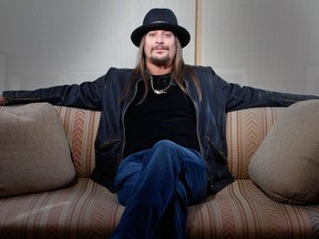 This Nov. 14, 2012 file photo shows Grammy-award winning artist Kid Rock posing for a portrait in New York. Kid Rock's “$20 Best Night Never Tour” kicks off June 28 in Bristow, Va., and opening acts include ZZ Top, Uncle Kracker and Kool and the Gang. (Photo by Carlo Allegri/Invision/AP, file)