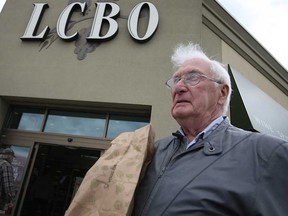 Ken Morris walks out of the LCBO at The Roundhouse Centre on Howard Avenue in Windsor, Ont., Sunday, May 12, 2013.  Morris says he isn't concerned with the effects of a potential LCBO strike.  (DAX MELMER/The Windsor Star)