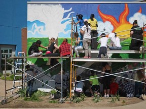 Riverside high school students work on an anti-bullying mural at the Safety Village in the east side of Windsor, Ont., Sunday, May 26, 2013.  The mural represents a creative means to raise awareness for bullying.  (DAX MELMER/The Windsor Star)