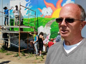 Wayne Kinghorn stands in front of an anti-bullying mural at the Safety Village in the east side of Windsor, Ont., Sunday, May 26, 2013.  Kinghorn's daughter, Stephanie Kinghorn, committed suicide 10 years ago at the age of 15 after being bullied.  The mural represents a creative means to raise awareness for bullying.  (DAX MELMER/The Windsor Star)