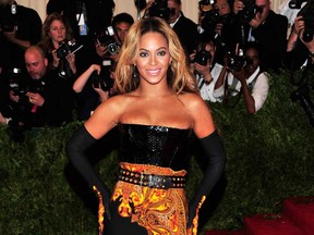 This May 6, 2013 file photo shows singer Beyonce at The Metropolitan Museum of Art's Costume Institute benefit in New York. Beyonce is cancelling her Tuesday, May 14, concert in Belgium because of dehydration and exhaustion. In an email to The Associated Press, the singer's publicist says Beyonce has been advised by her doctors to rest. She was scheduled to perform at the Sportpaleis in Antwerp. The show will be rescheduled and tickets can be used at that show. (Photo by Charles Sykes/Invision/AP, file)