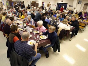 In this file photo, patrons enjoy their dinner during the annual American Thanksgiving Day dinner at the Cottam United Church in Cottam, Ont. (Windsor Star files)