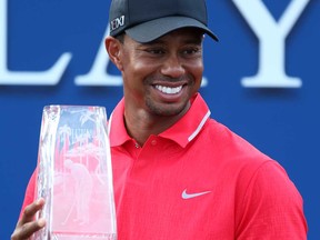 Tiger Woods of the U.S. holds the winner's trophy after the final round of The Players Championship on May 12, 2013 in Ponte Vedra Beach, Fla.  (Photo by Andy Lyons/Getty Images)