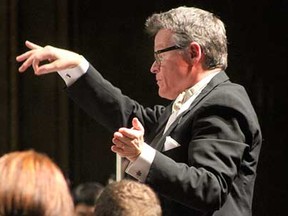 Windsor Symphony Orchestra conductor laureate John Morris Russell conducts during the Russell and Scheirich Reunited concert at the Capitol Theatre in Windsor, Ont., on Saturday, May 11, 2013. (REBECCA WRIGHT/ The Windsor Star)